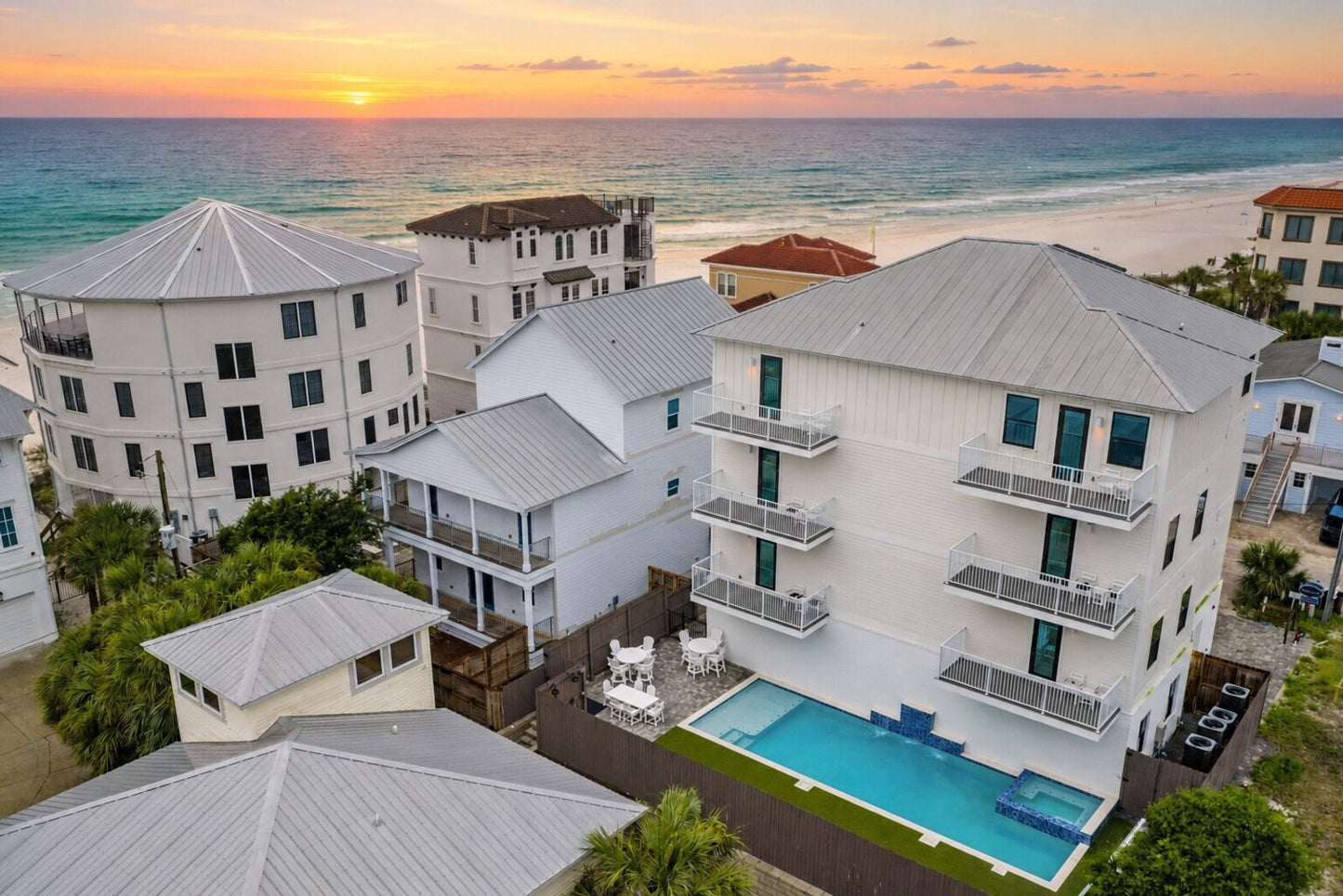 Emerald Retreat beachfront home with pool at sunset
