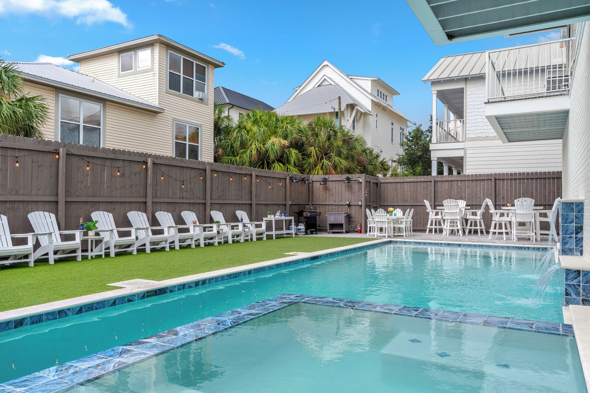 Private backyard pool and sunbathing deck