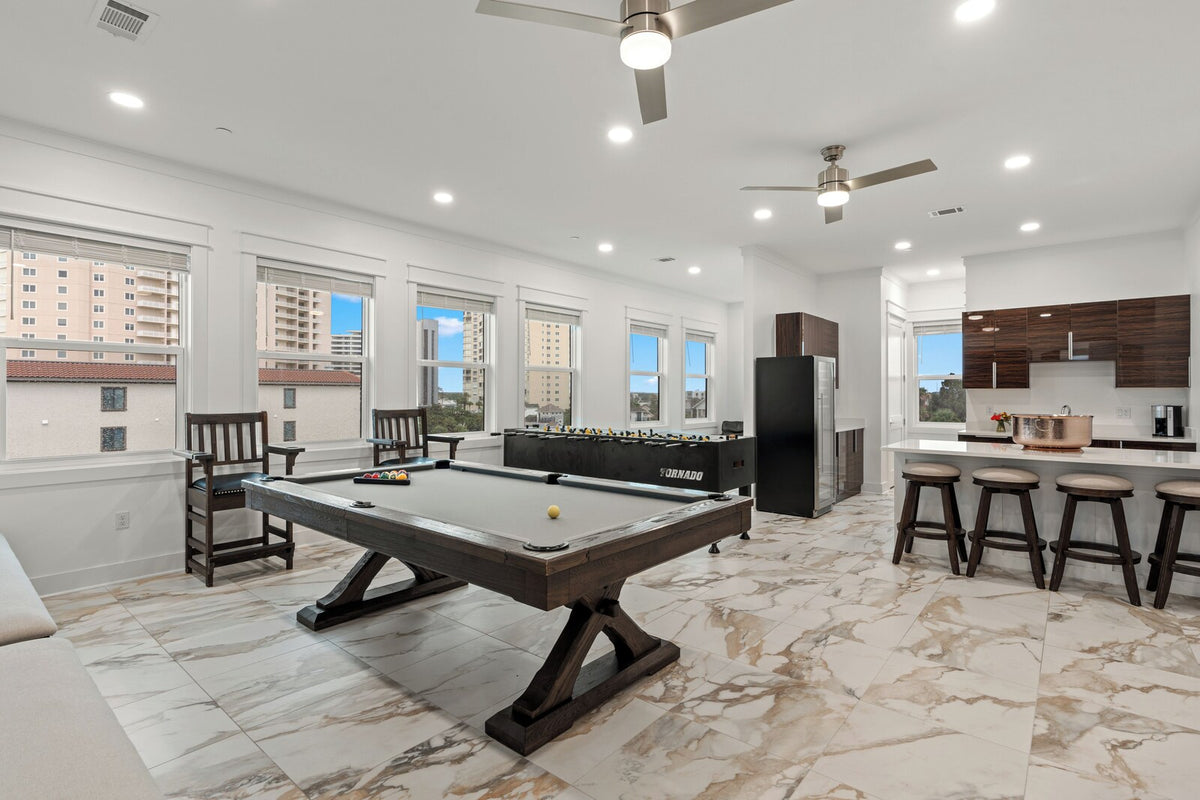 Game room with pool table and bar